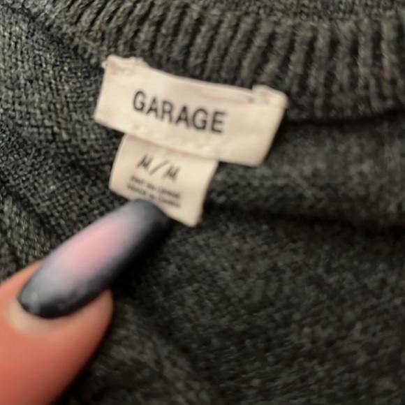 Grey sweater with both arms having a cutout design. - Picture 3 of 3